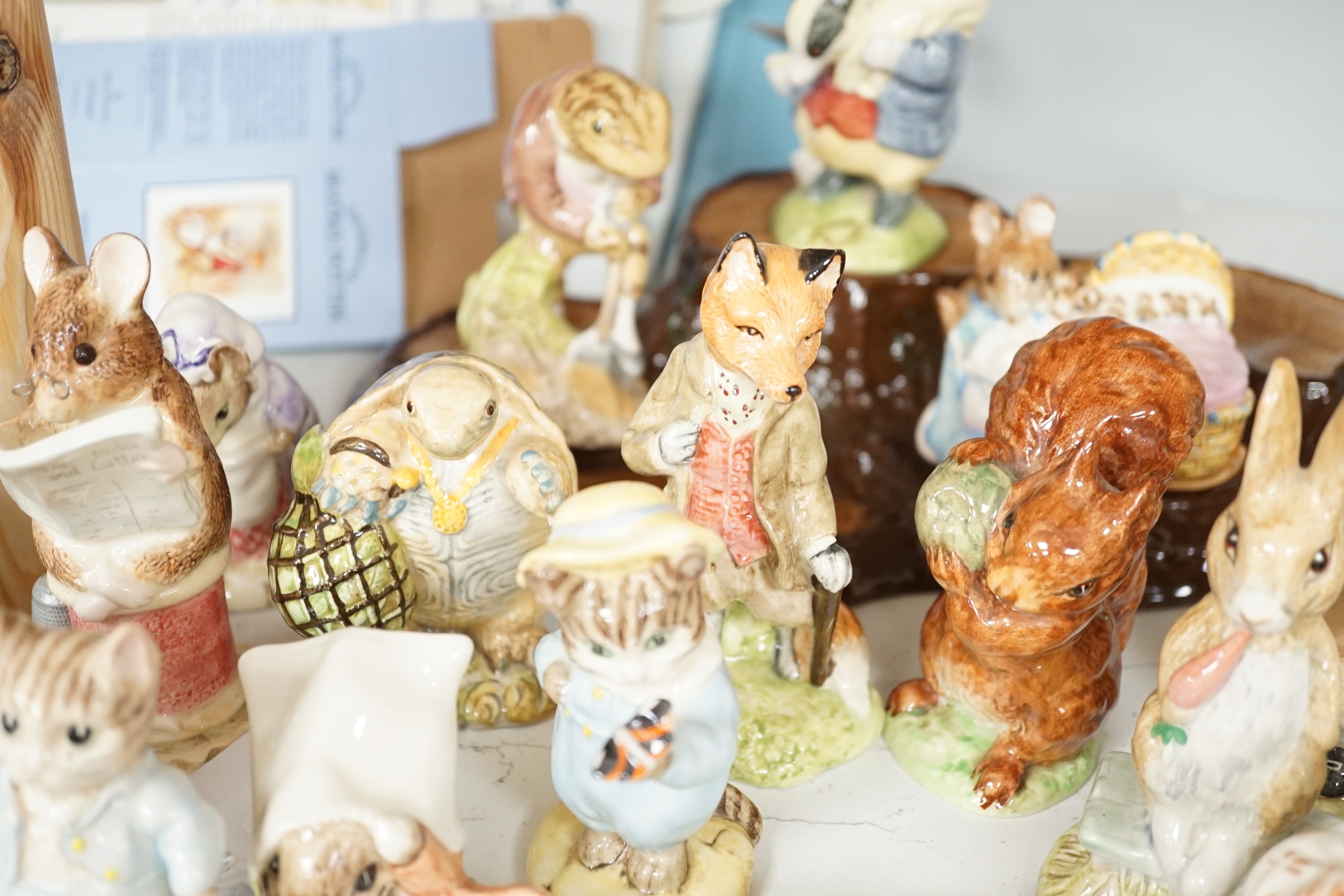 A collection Beswick, Royal Albert and Border Fine Arts Beatrix Potter figures